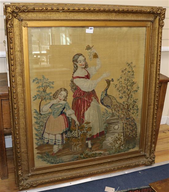 A 19th century Berlin needlework panel, depicting two girls and a peacock, 99 x 86cm